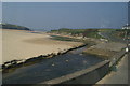 The river flowing across Porth Beach