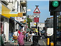 A busy pavement on Harrow Road