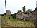 SJ3612 : Old windmill and derelict buildings by E Gammie