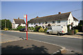 Bus stop & housing on principal road in Nunton