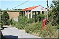 SW9270 : Disused Barn and Telephone Box by Tony Atkin