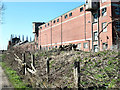 Disused Maltings next to the railway at Milford Junction.