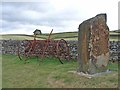 NY7987 : Millennium stone and old hayrake at Greenhaugh by Oliver Dixon