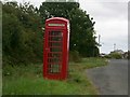 Telephone box near minor crossroads