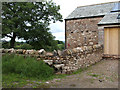 Stile and converted barn.