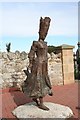 NH9184 : Bronze figure at Portmahomack by Des Colhoun