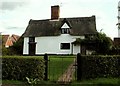 TM0246 : Farmhouse at Street Farm, Whatfield, Suffolk by Robert Edwards