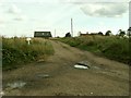 TM0346 : Farm road at Whitehouse Farm, near Whatfield, Suffolk by Robert Edwards
