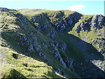 NH1671 : Crags under east ridge of Sgurr Breac by Roger McLachlan