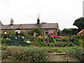 Scarecrows at cottage Rennington Northumberland