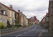 SE9282 : The village street, Snainton by Humphrey Bolton