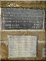 Nameplate detail on the memorial font near Hempsyke Farm