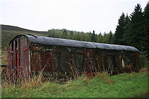 NJ4428 : An old railway carriage doubles as a shed west of Broomhill. by Des Colhoun