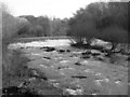 Fast running water at the weir on River Roch