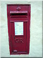 Post box embedded in wall