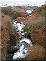 River entering the sea near Pont y Caletwr.