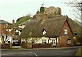 Thatched cottage with Eye Castle behind