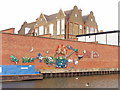 Canalside mural from litter