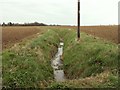 A ditch across farmland