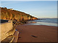 SX8957 : Broadsands beach: Concrete, sand and sandstone cliff by Tom Jolliffe