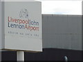 SJ4283 : Sign at the roundabout before John Lennon Airport by Darrin Antrobus