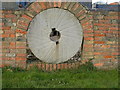 Mill Stone in a Wall