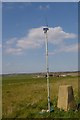 Trig point and telemetrics at Hainey Hill; Ely Cathedral in distance.