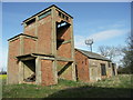 Derelict Grain Store and Mast.