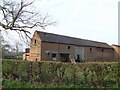 SJ8518 : Brick barns at Apeton Manor Farm by John M