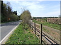 Fenced off old road alongside A1075