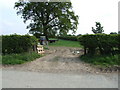 Field entrance and tractor near Little Pentredafydd