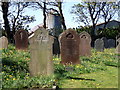 Gravestones and farm buildings