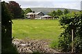 House beyond a grass field