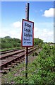 SJ3668 : Beware of Trains Sign near Saughall by Jeff Buck