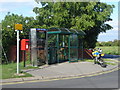 Telephone box and friends, at road junction