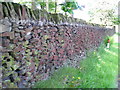 Red-coloured dry stone wall along Redcar Lane