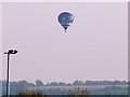 Plane and balloon over Wanborough