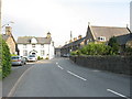 The main street of Llanuwchllyn with the old schoolhouse on the left