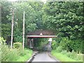 View along Sutton Lane under the railway bridge