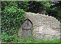 Small door in old stone wall