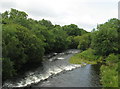 SH5163 : In full flow again. Afon Seiont from Pont-rug bridge by Eric Jones