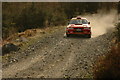 NJ5723 : rally car hanging on to the forest track in Whitehaugh by Steven Brown