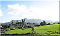 Rhedyn-cochion farmhouse framed against Cadair Idris mountain