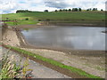 The empty Cocksburn Reservoir