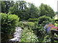 Rushing stream and cottage garden