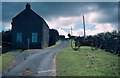 NT9560 : Farmhouse on a narrow asphalt road by David Douglas