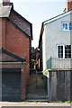 Footpath squeezed between two houses