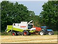 Claas combine and a blue tractor, Overtown, Swindon