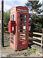 Telephone kiosk with post box