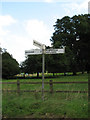 TG1335 : Signpost at Northfield Road junction with view into Barningham Park by Evelyn Simak
